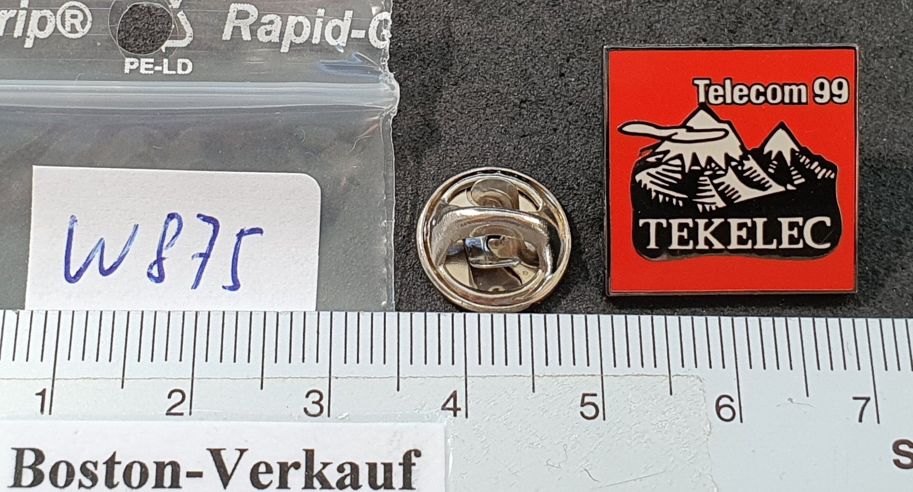 Placchette & Badge: W875 - Pin Telecom 1999  TEKELEC – Usato da Reinach BL venduto da Boston-Verkauf 1