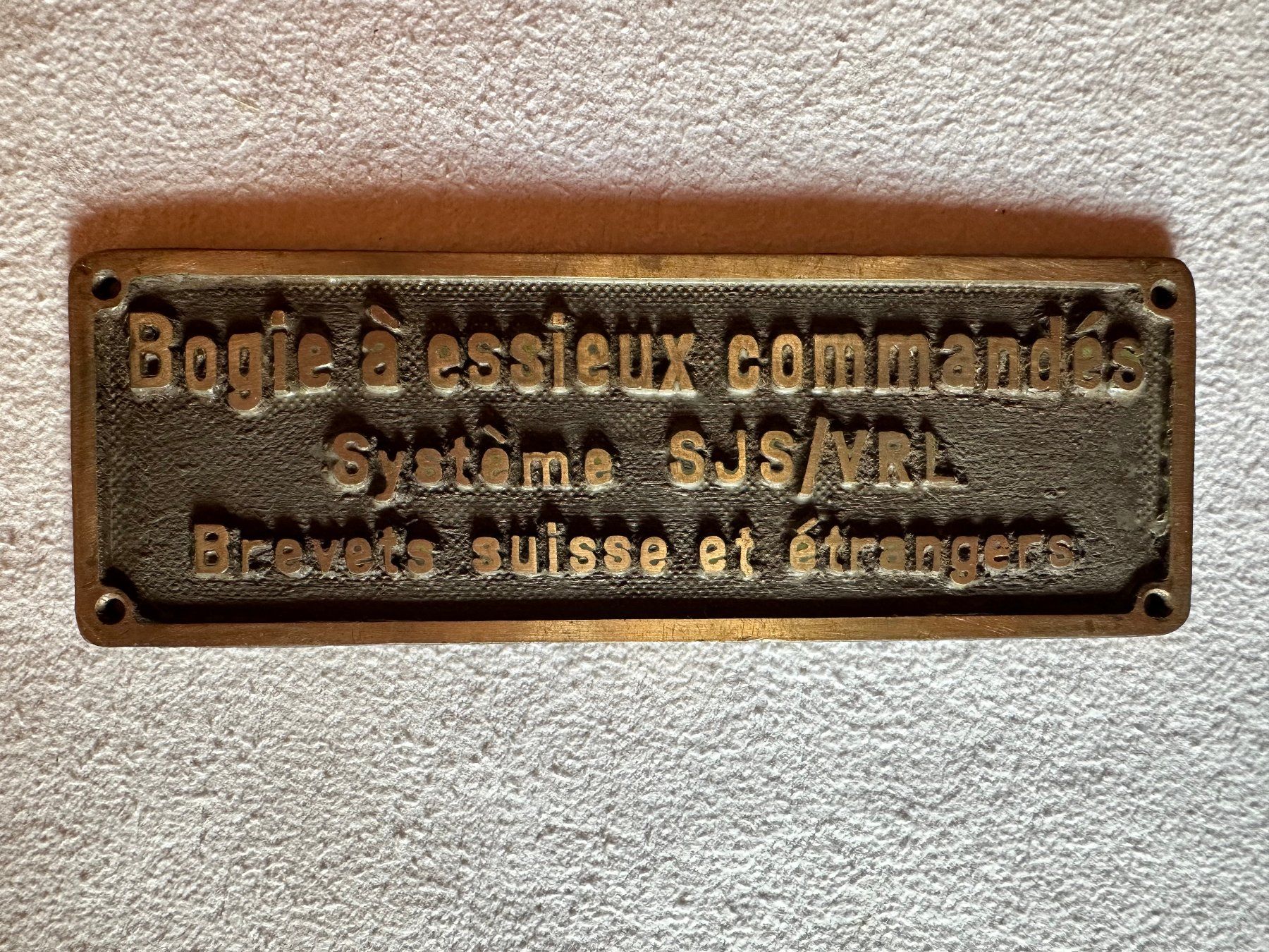Schilder: Plaque "Bogie à essieux commandés" – Gebraucht aus Ste-Croix von mjmg