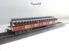 Märklin. H0 4473 Niederbordwagen mit Gleis
