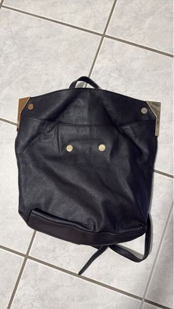 Stylish Black Backpack with Metal Accents