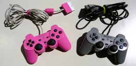 PS2, 2 joystics/controler rose/gris,  bon état, fonctionnels