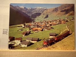AK von Sedrun mit Bahn