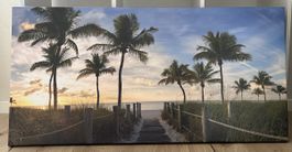 Leinwandbild Palmenstrand mit Sonnenuntergang