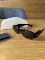 Lunettes de soleil Prada