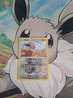 Evoli 125/203 reverse Holo Drachenwandel
