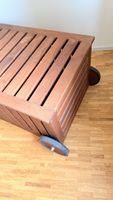 Gartenbox Holz mit Rollen braun.