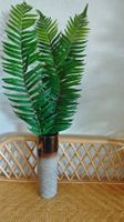 Vase avec verdure artificielle