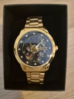 Automatikuhr goldfarben mit schwarzem verspielten Skeleton