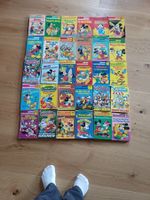 9 Donald Duck und 21 Mickey Mouse Hefte