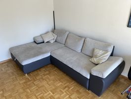 Ecksofa mit Bettfunktion und Stauraum, grau, mit Flecken