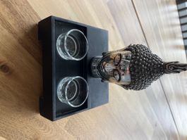 Buddha-Kopf mit zwei Teelichtern
