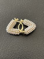 Jolies boucles d’oreilles et petites perles neuves