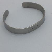 Bracelet à texte WEIRD
