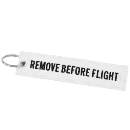 Portachiavi: Schlüsselanhänger REMOVE BEFORE FLIGHT weiss – Nuovo e nell'imballaggio originale da Bern venduto da aeroshop.ch