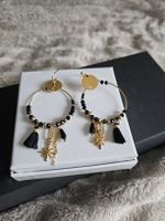 belles boucles d'oreilles neuves