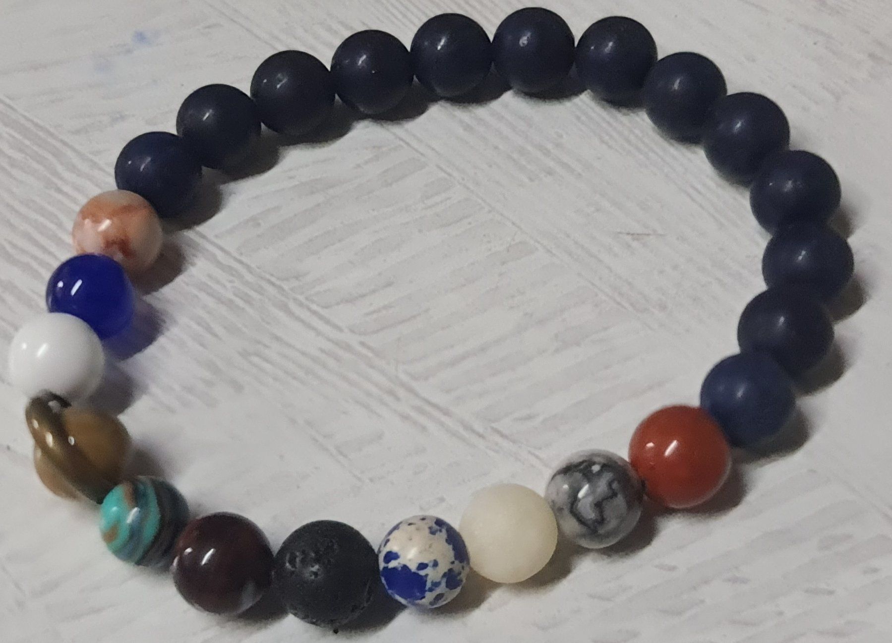 Bracciali & Braccialetti: Solar System Planeten Armband aus Stein – Nuovo e nell'imballaggio originale da Uerkheim venduto da Kaufoption 2