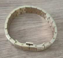 Bracelet doré Tissot modèle T04...