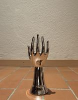 Objet de décoration main en céramique argentée