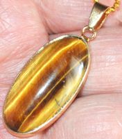 Halskette 4592 – Oval – Tigerauge– 15x30 goldig eingefasst