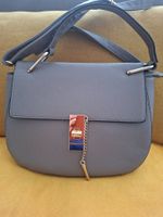 Sac bandoulière gris fermeture cadenas neuf