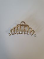 Pince à cheveux metalique doré