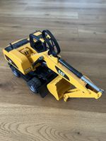 Spielzeug Bagger Caterpillar CAT gelb gebrauchter Zustand