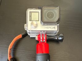 GoPro Hero4 vendue avec boitier étanche et poignée.