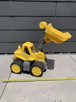 Spielzeugbagger für den Sandkasten