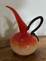 Antique orange carafe