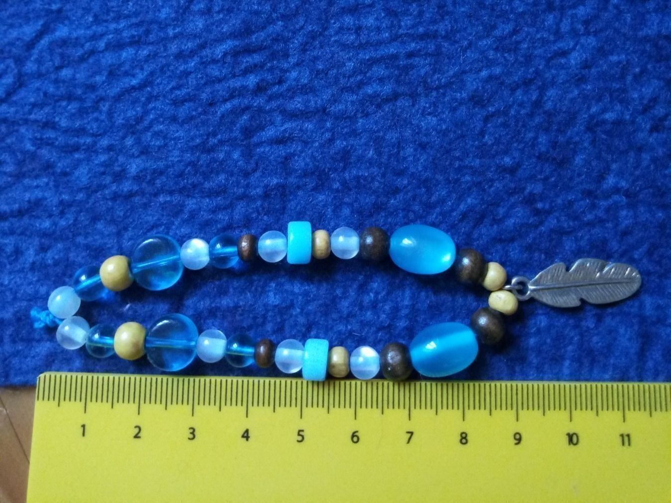 Bracciali & Braccialetti: Modeschmuck/Armband mit Federanhänger – Nuovo (secondo la descrizione) da Beckenried venduto da Havacola 1