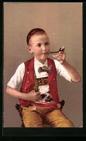 Schweizer Junge in Tracht mit Tabakpfeif