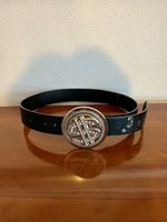 Ceinture grosse boucle $ qui tourne