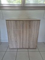 Low wooden cupboard with two doors in good condition