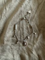Guess Armband silberfarben mit Anhängern neu