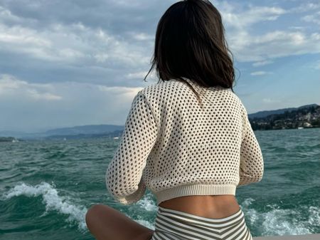 Chic beige knit cropped cardigan, perfect for summer breezy