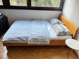 Wooden double bed complete with mattress & bedding