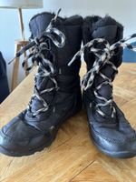 Bottes d'hiver Sorel noires, chaudes et confortables.