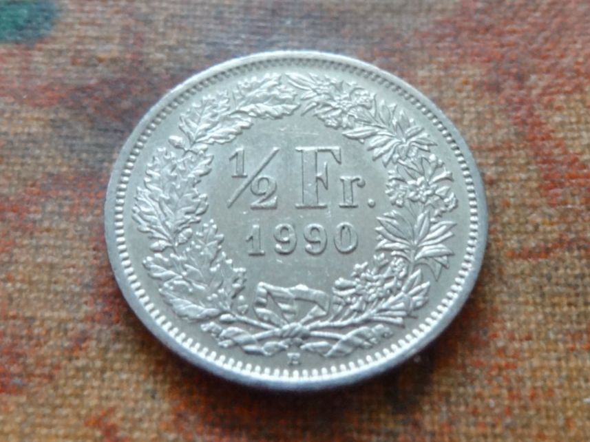 Tutti le monete: 1/2 Fr. 1990 – Usato da Romanel-sur-Lausanne venduto da Swift13