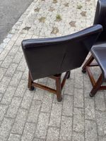 Two rotable chairs brown leather wood frame with wheels