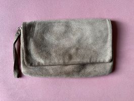 Stylish suede bag with wrist strap