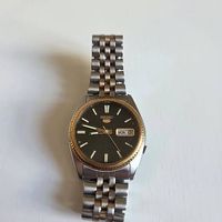 Seiko 5 automatique vintage cadran noir lunette doree