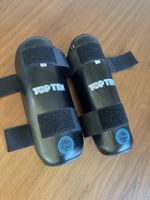 Top Ten black shin guards, size M