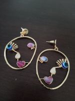 Magnifique boucles d'oreilles visage abstrait