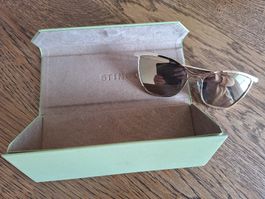 goldene Sonnenbrille verspiegelt Sting