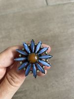 Ring Blumenform blau mit braunem Stein verstellbar