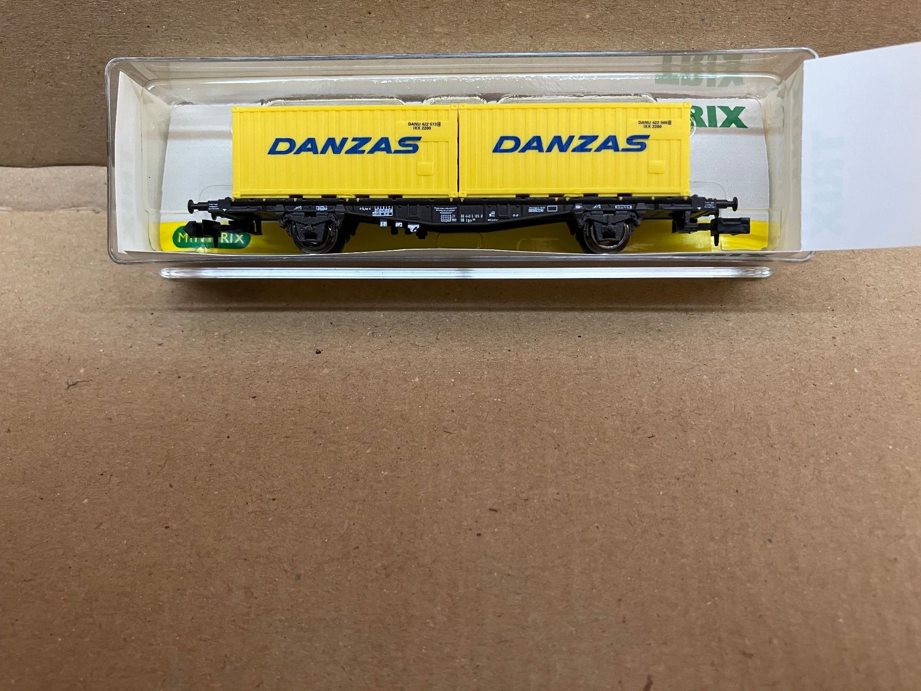 Trix Modellini di ferrovie: Minitrix 15609 2-achsiger Containertragwg. "DANZAS" DB/SBB – Nuovo (secondo la descrizione) da Neuendorf venduto da sitek071 2