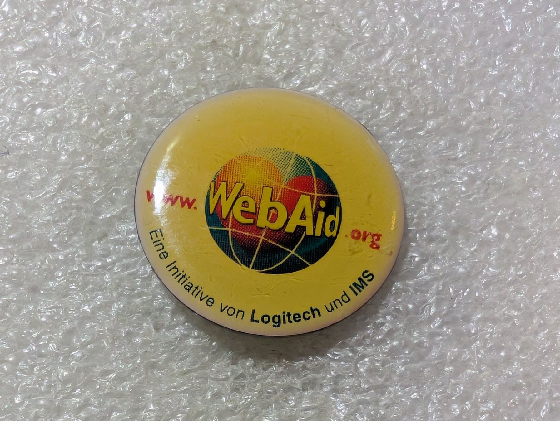 Plaketten & Abzeichen: Ansteckpin 107: Webaid Logitech – Gebraucht aus Oppligen von Pin-Fall-Shop
