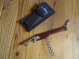 Kellnermesser, Griff aus weinrotem Kunststoff u. Edelstahl