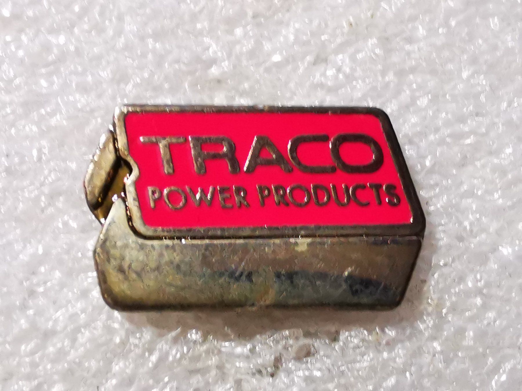 Placchette & Badge: Ansteckpin 192: Traco Power – Usato da Oppligen venduto da Pin-Fall-Shop