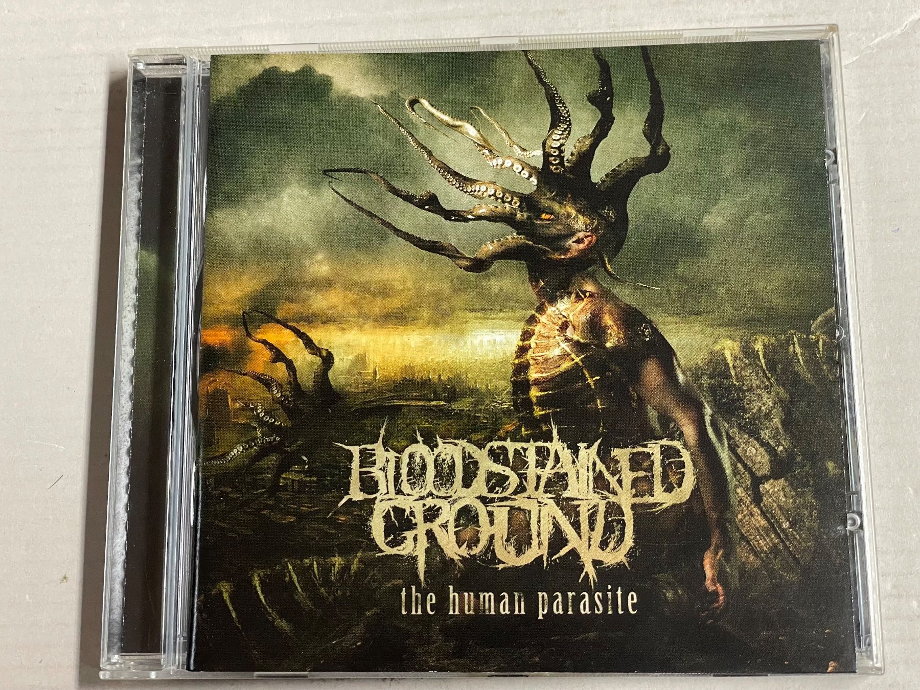 CD: Bloodstained Ground - The Human Parasite – Usato da Muri b. Bern venduto da AdidasCollector 4